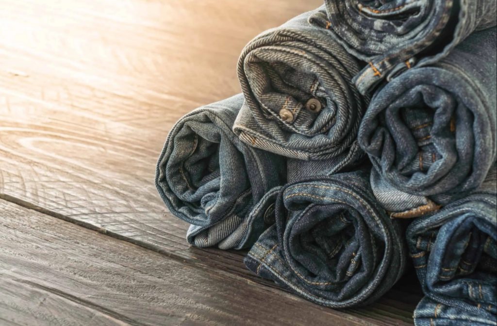 Jeans rolled up on a table