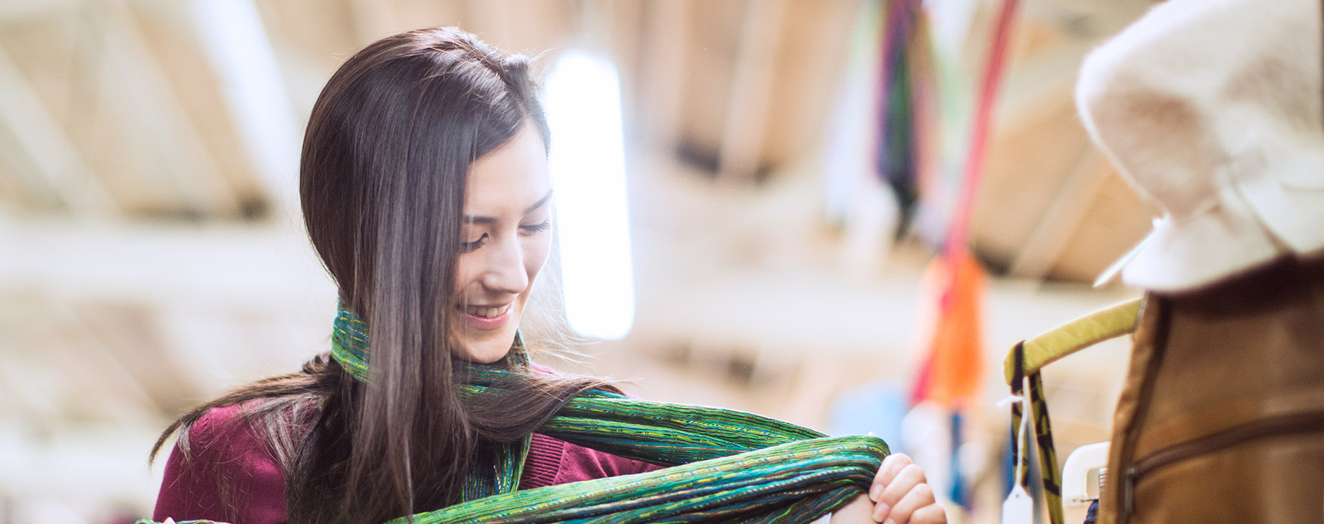 Women looking at a scarf she is wearing