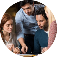 Group of people looking at something on a table