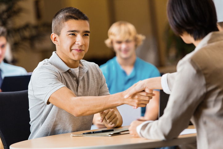 young man shaking business person's hand | job fair | Goodwill Industries of Monocacy Valley