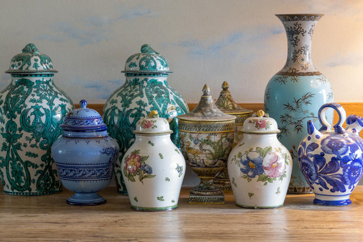 European and chinese antique vase on wooden table