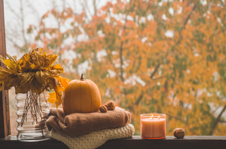 Autumn decor on a window. Cozy autumn or winter concept.