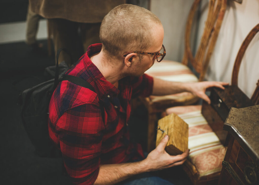 Man looking at Vintage furniture