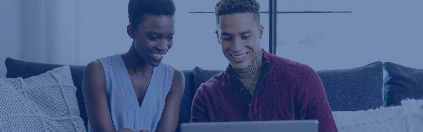Two People looking at a computer