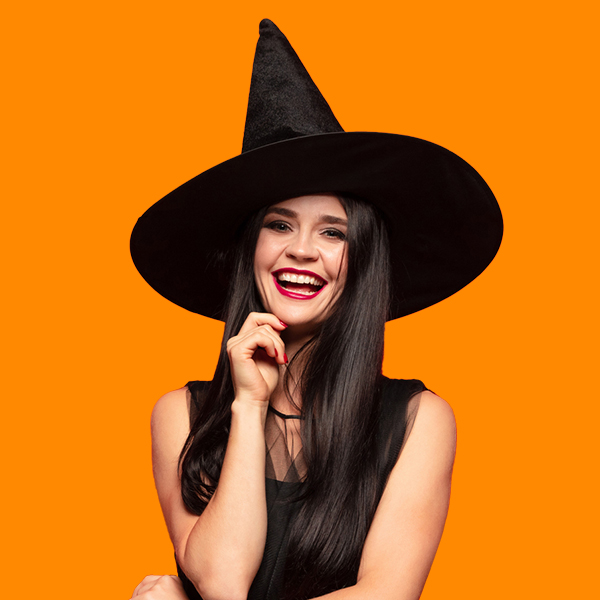 A woman wearing a black dress and a witch hat
