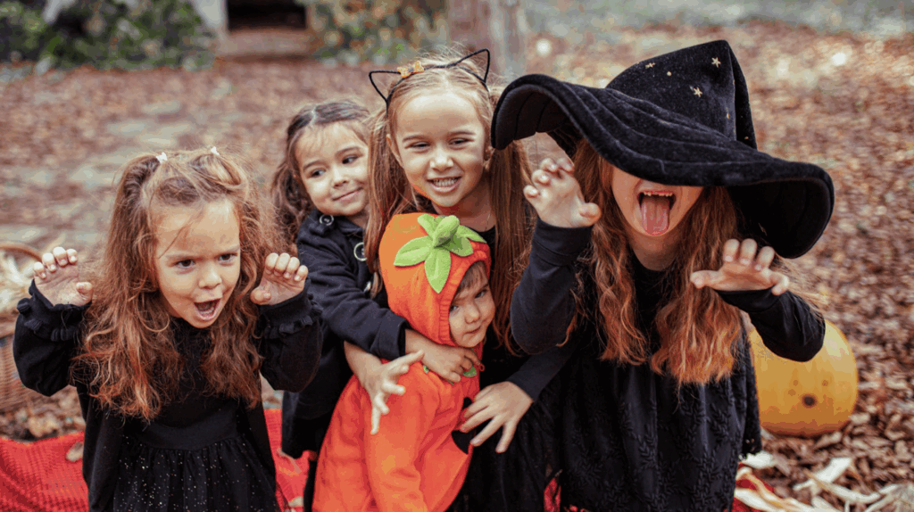 Multiple little kids in Halloween Costumes