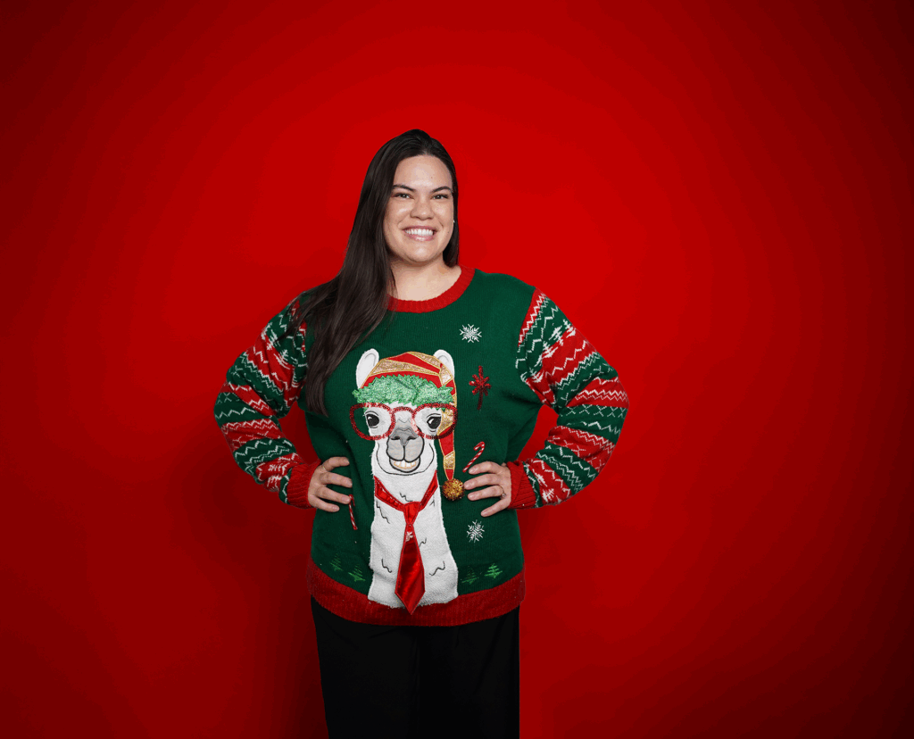 A women wearing a Christmas sweater