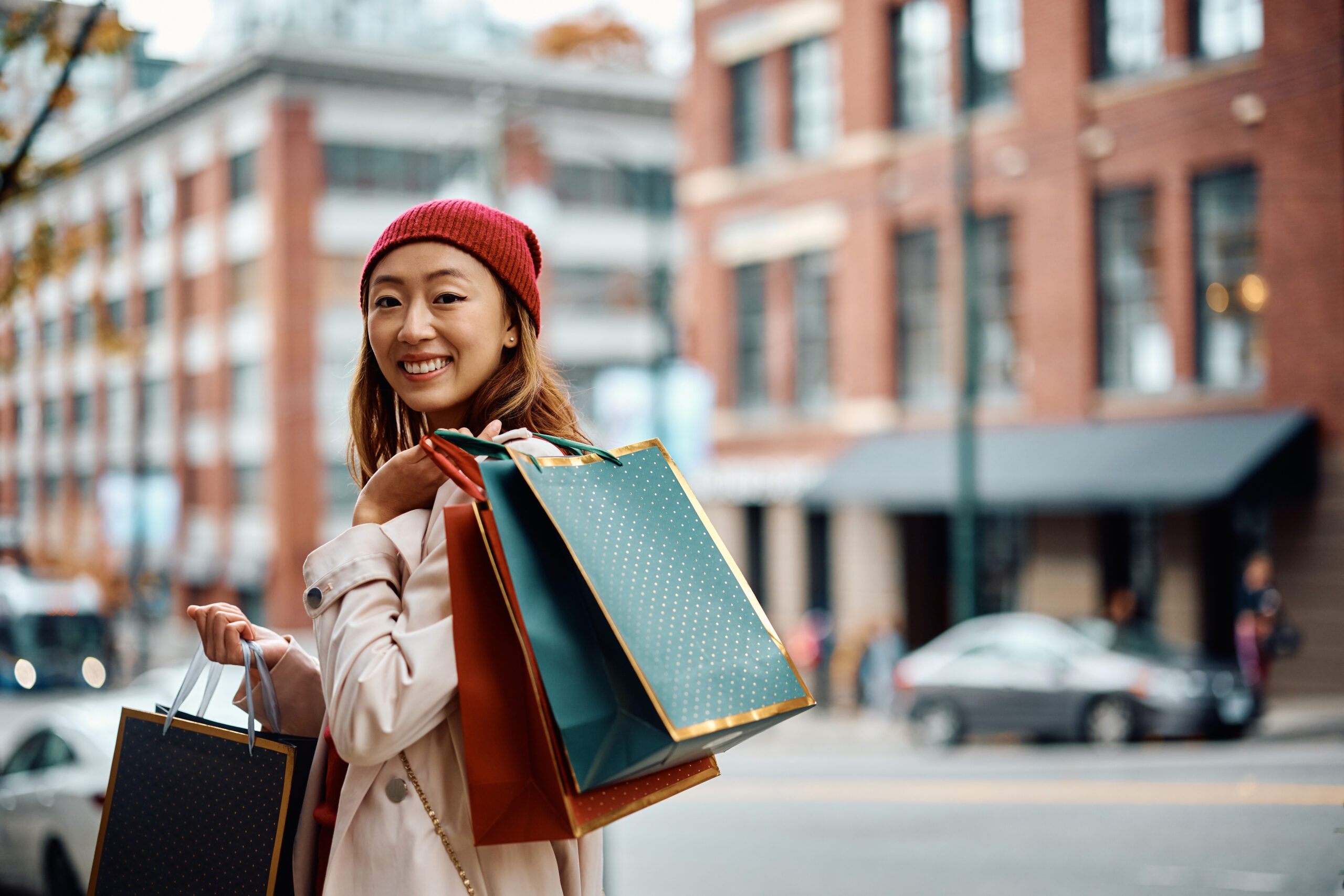 A women outside holding shopping bags