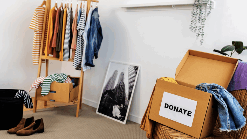 Interior of someones room with a clothing donation box