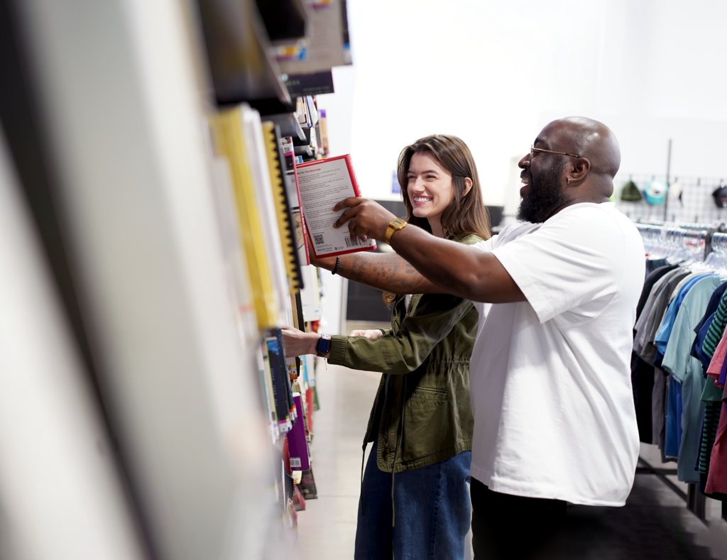 Man and woman browsing books at Goodwill